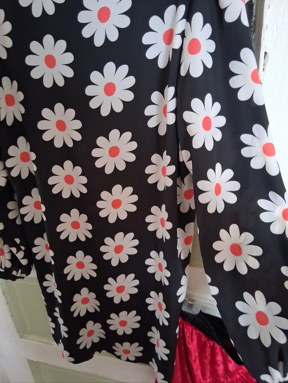 Almost Famous Black Long-Sleeve Daisy Top with Coral Centers